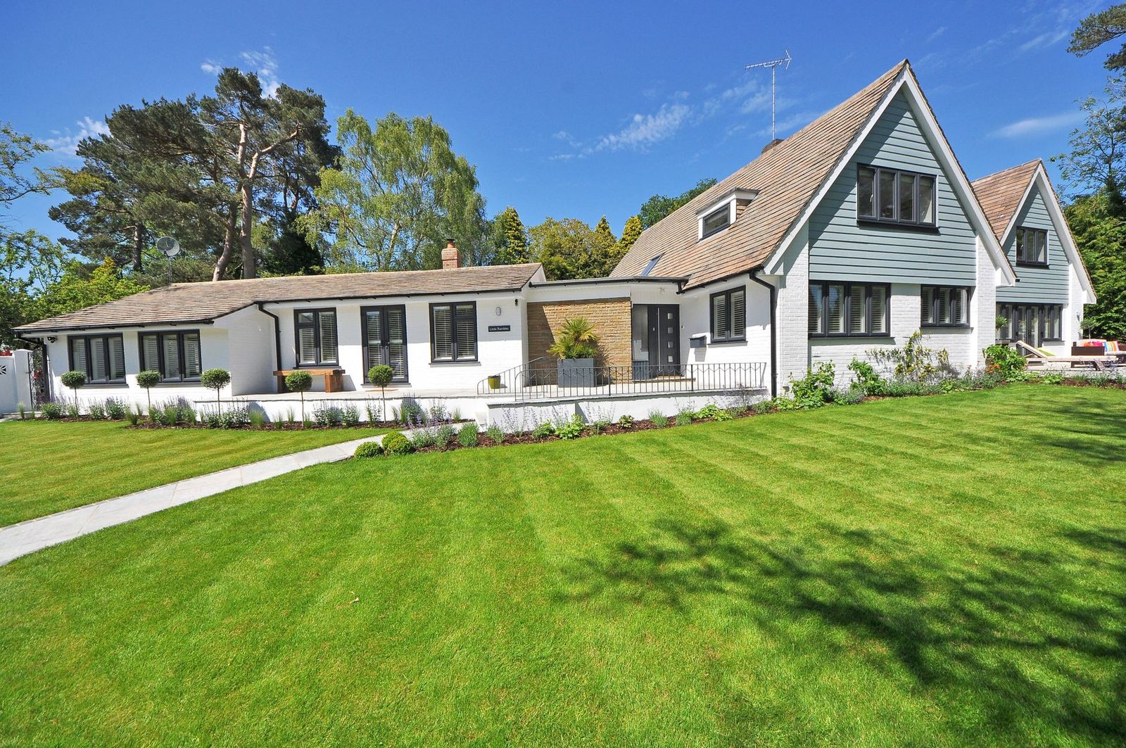 Freshly striped lawn in front of a well kept home